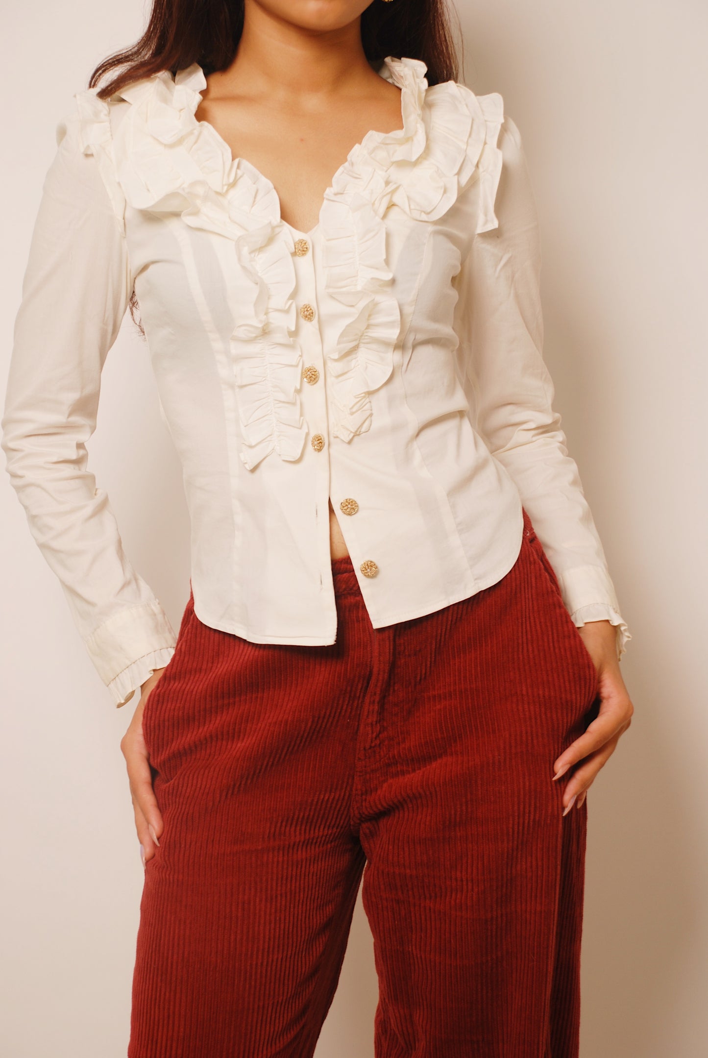 White ruffled full sleeve shirt with ornamental buttons