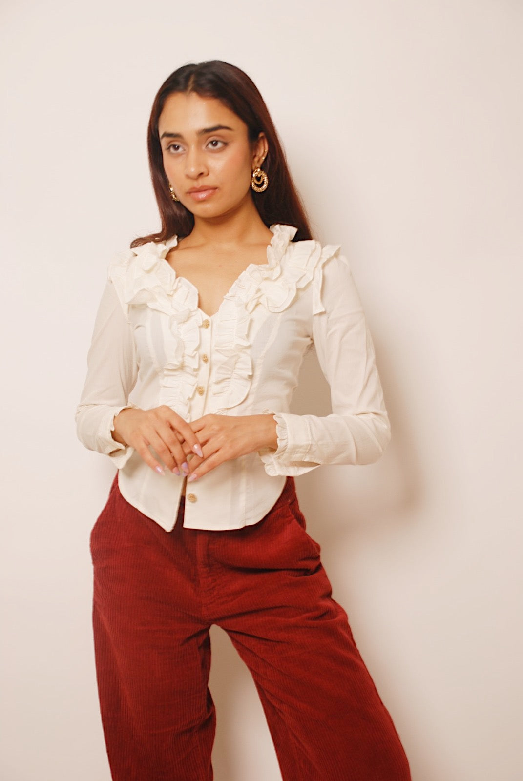 White ruffled full sleeve shirt with ornamental buttons