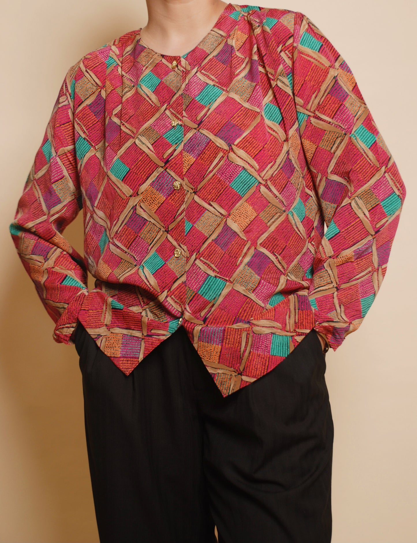 Pink printed blouse with gold ornamental buttons