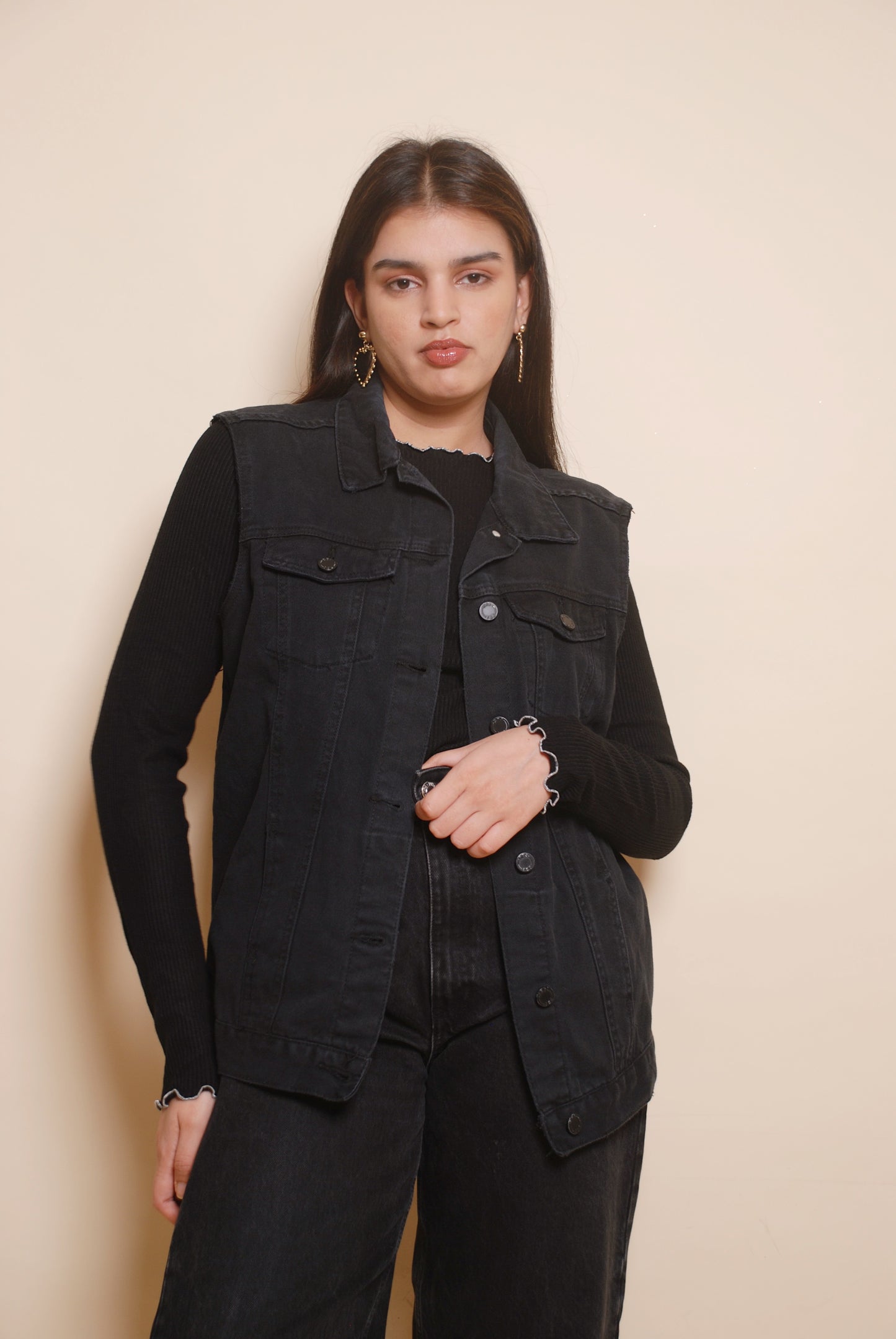 Black sleeveless denim jacket