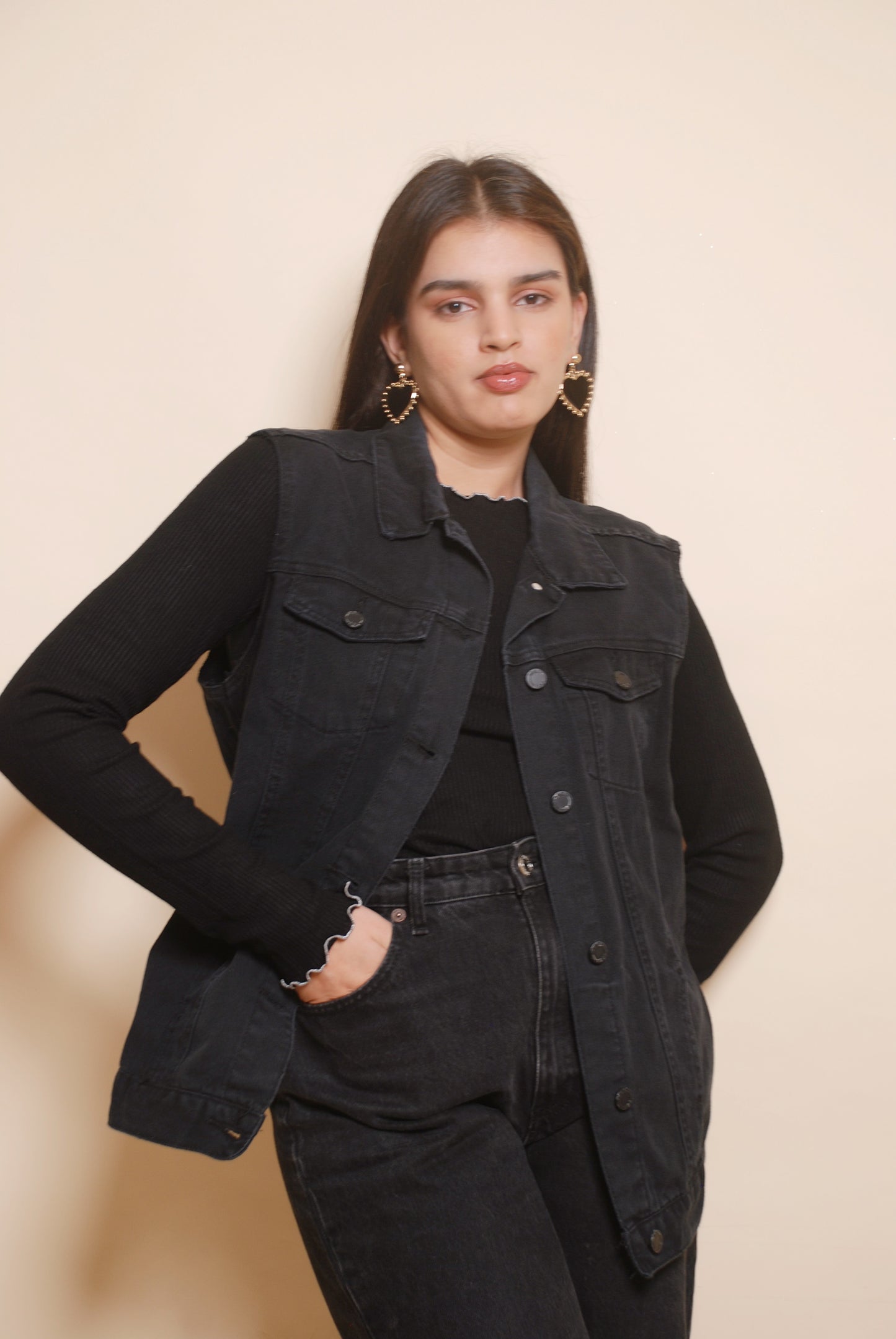 Black sleeveless denim jacket