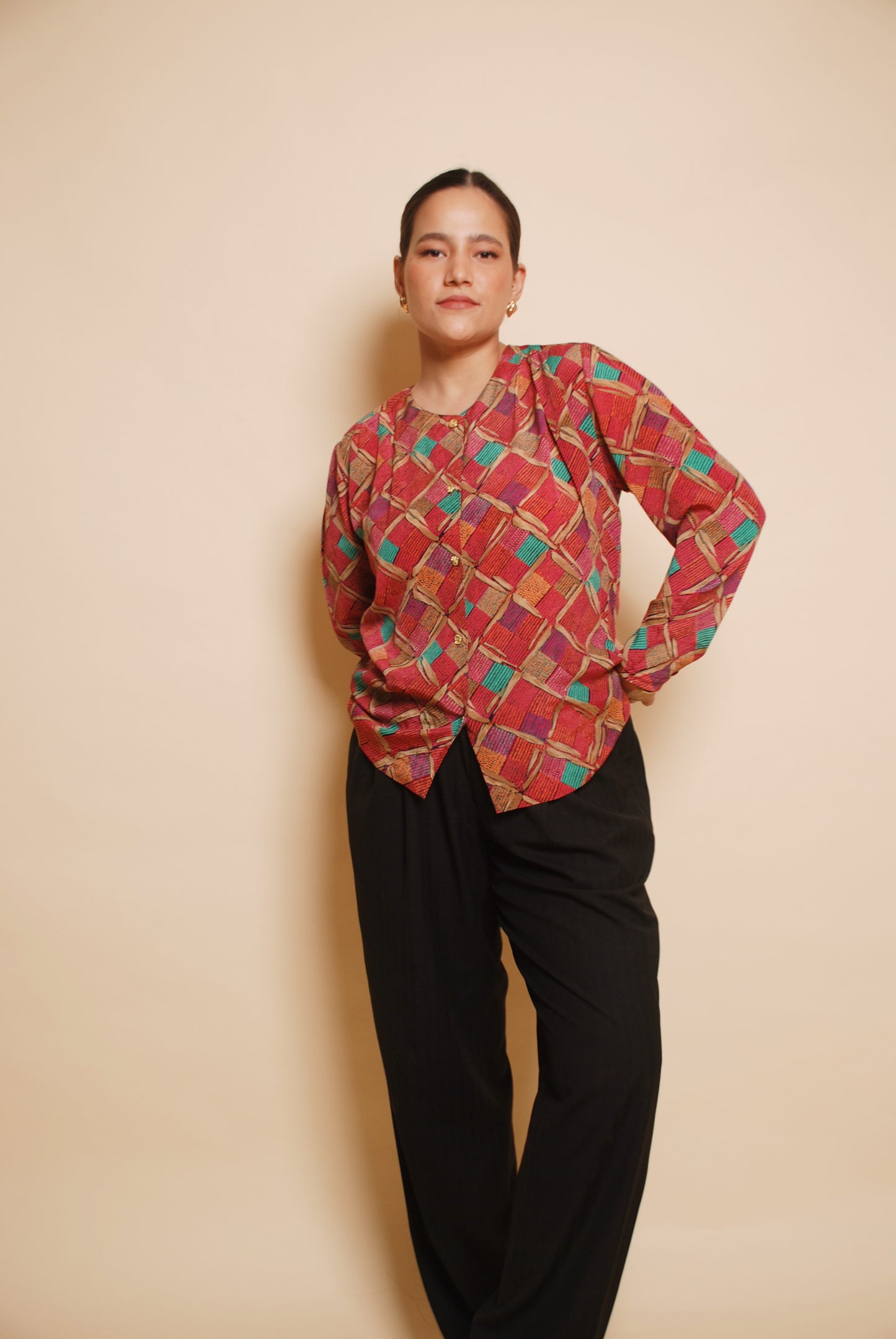 Pink printed blouse with gold ornamental buttons