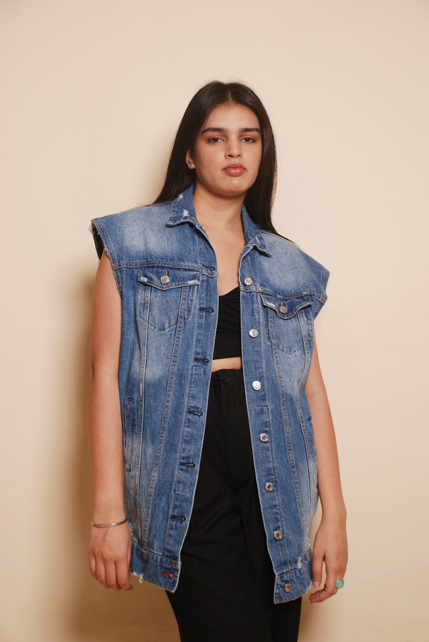 Blue sleeveless denim jacket