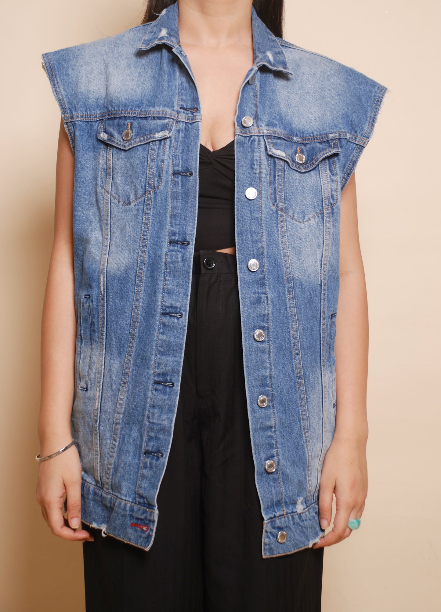 Blue sleeveless denim jacket