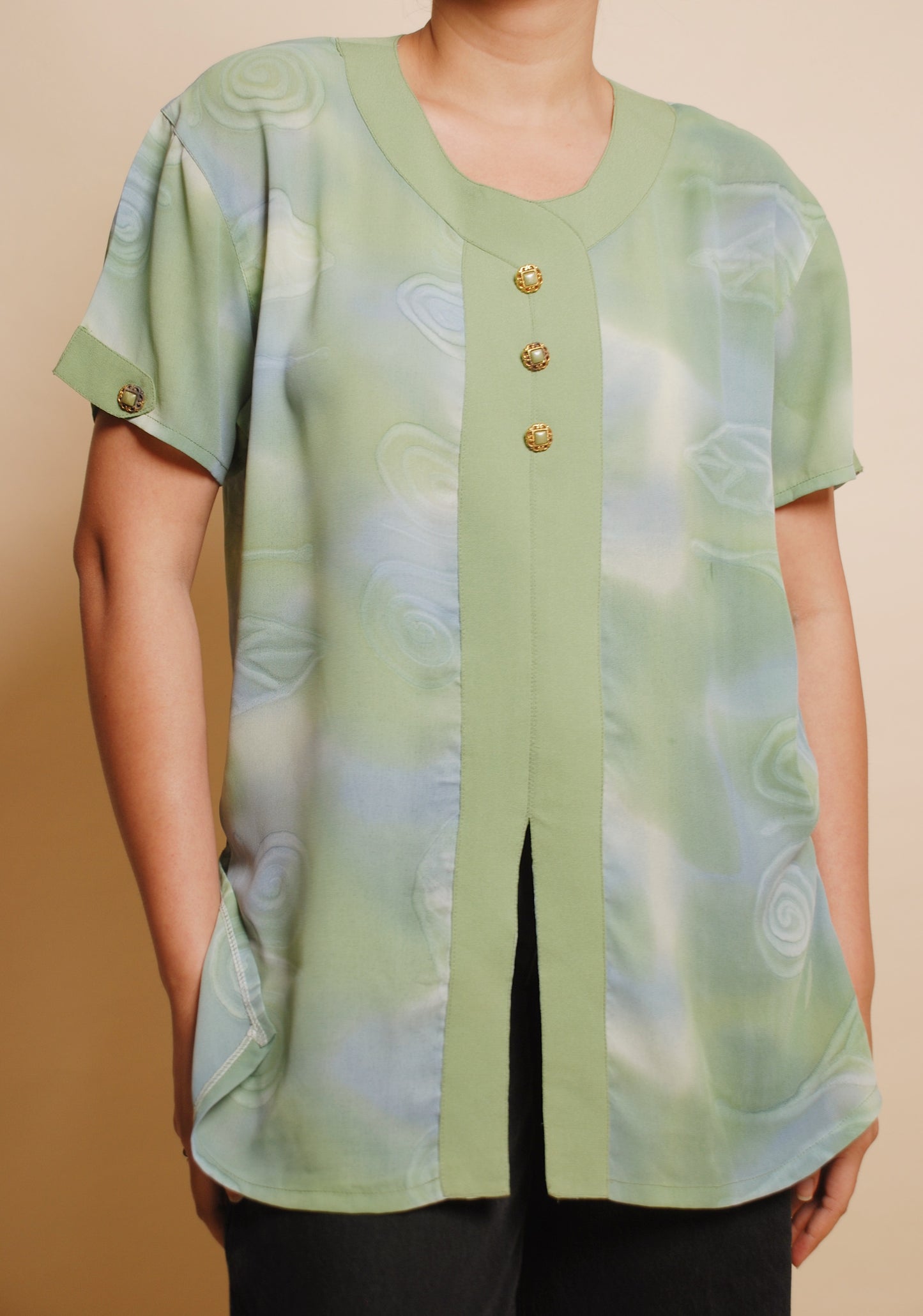 Green u-neck blouse with ornamental buttons