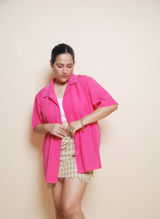 Bright pink shirt with cutout collar and floral embroidery