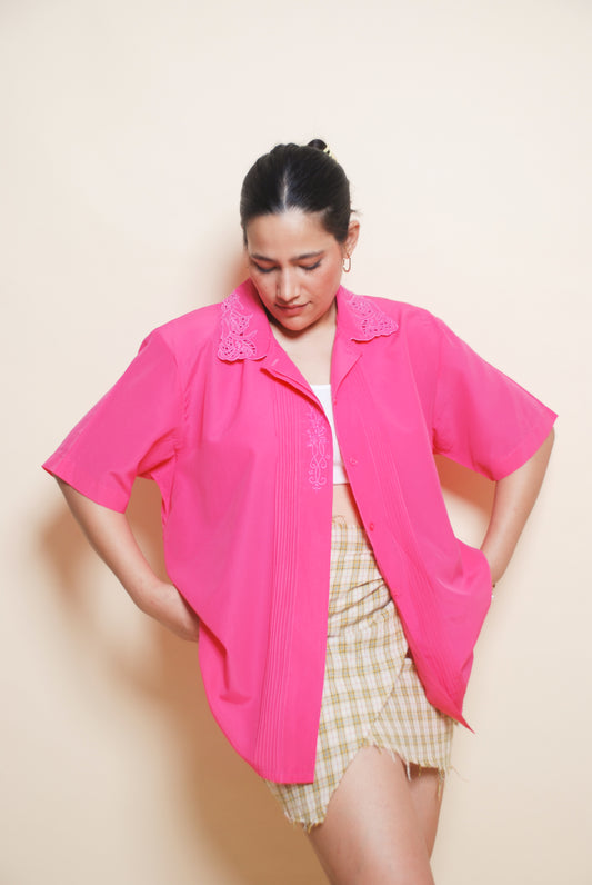 Bright pink shirt with cutout collar and floral embroidery