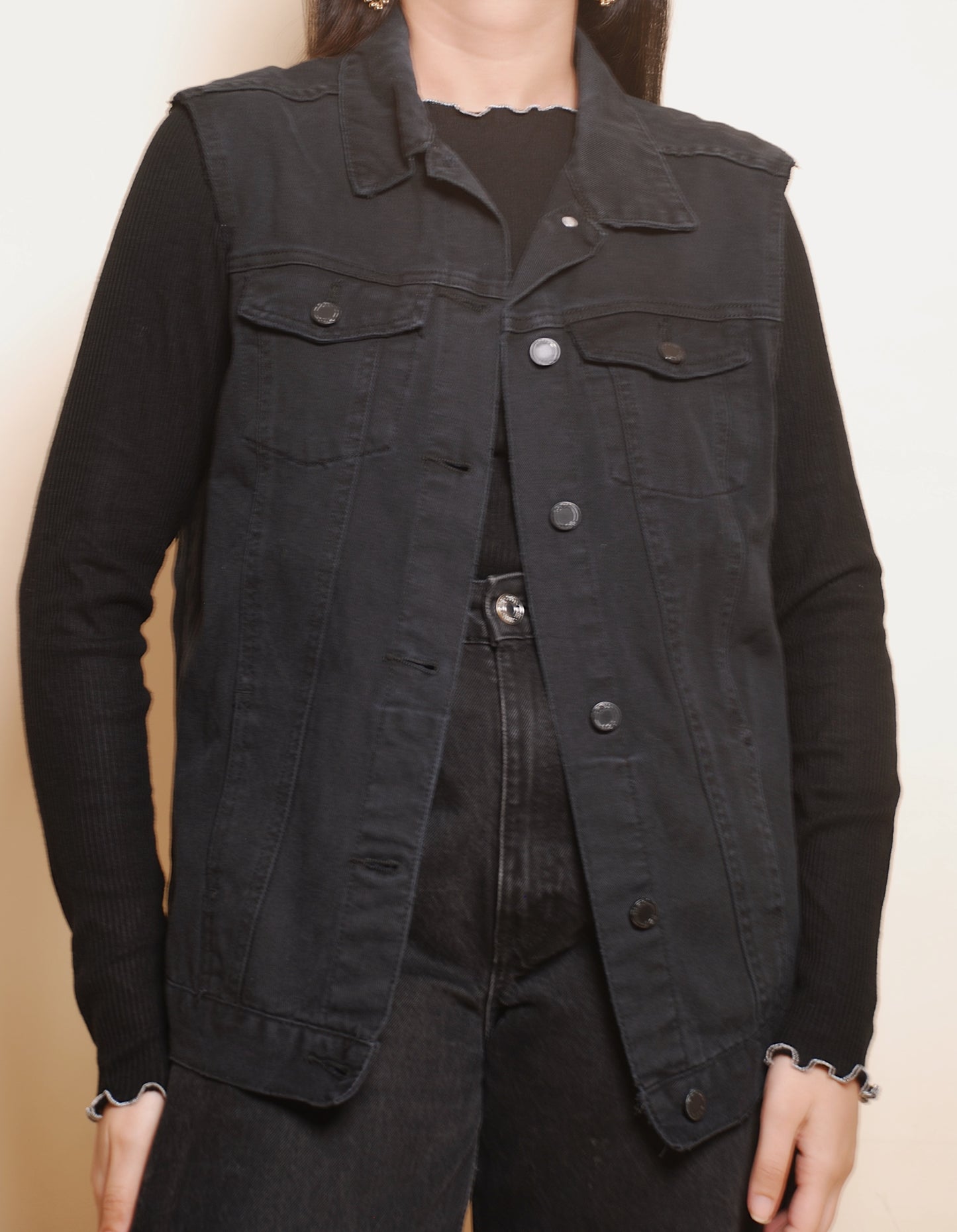 Black sleeveless denim jacket