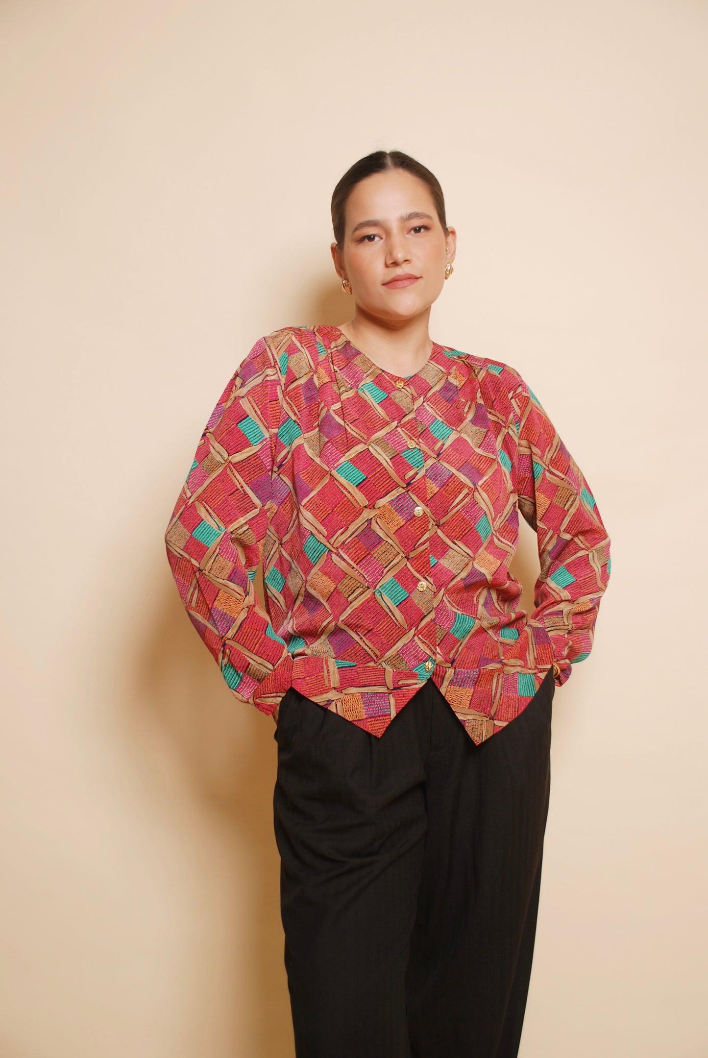 Pink printed blouse with gold ornamental buttons